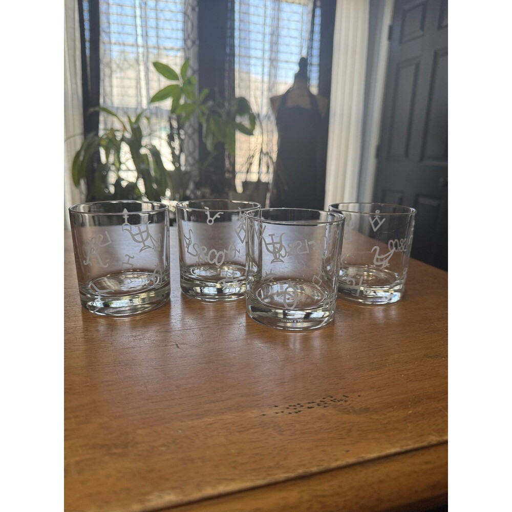 Tiffany & Co. branded crystal rocks glass featuring etched symbols set of 4